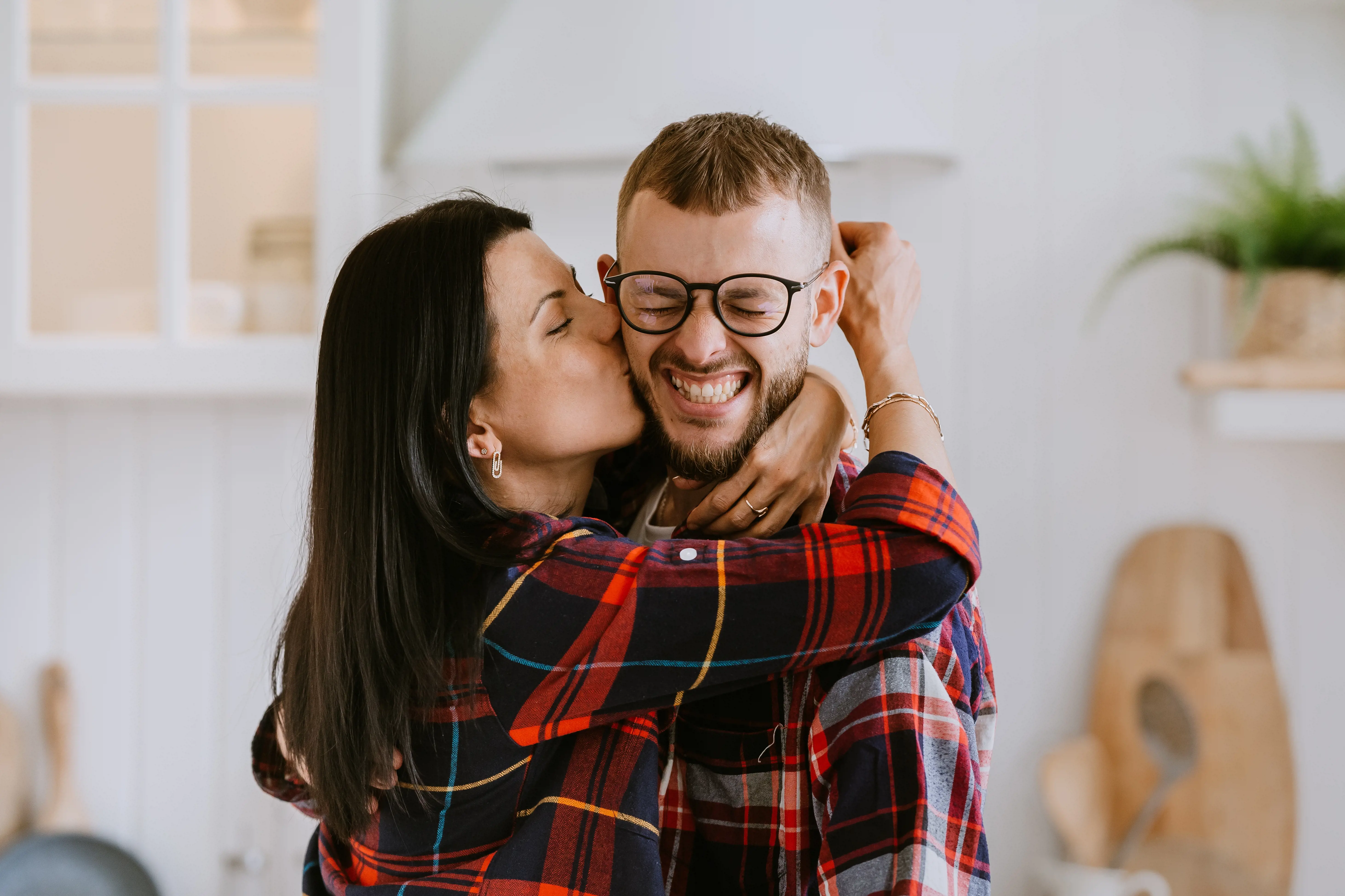 Happy couple moving into their first home