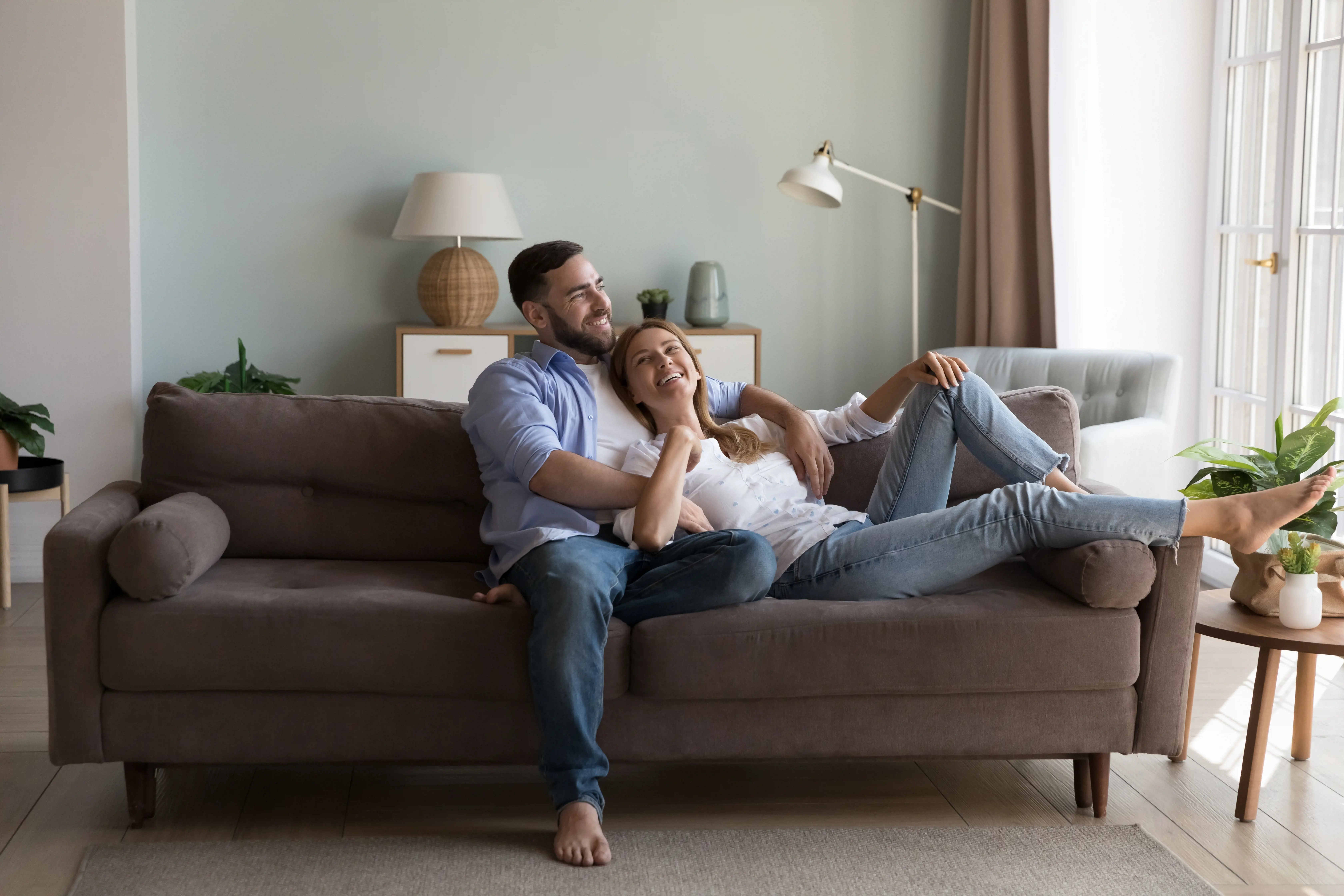 Couple on a sofa in new Gecko home